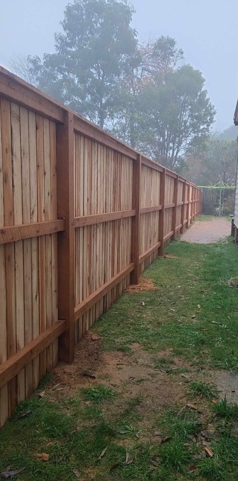 Long timber boundary fence