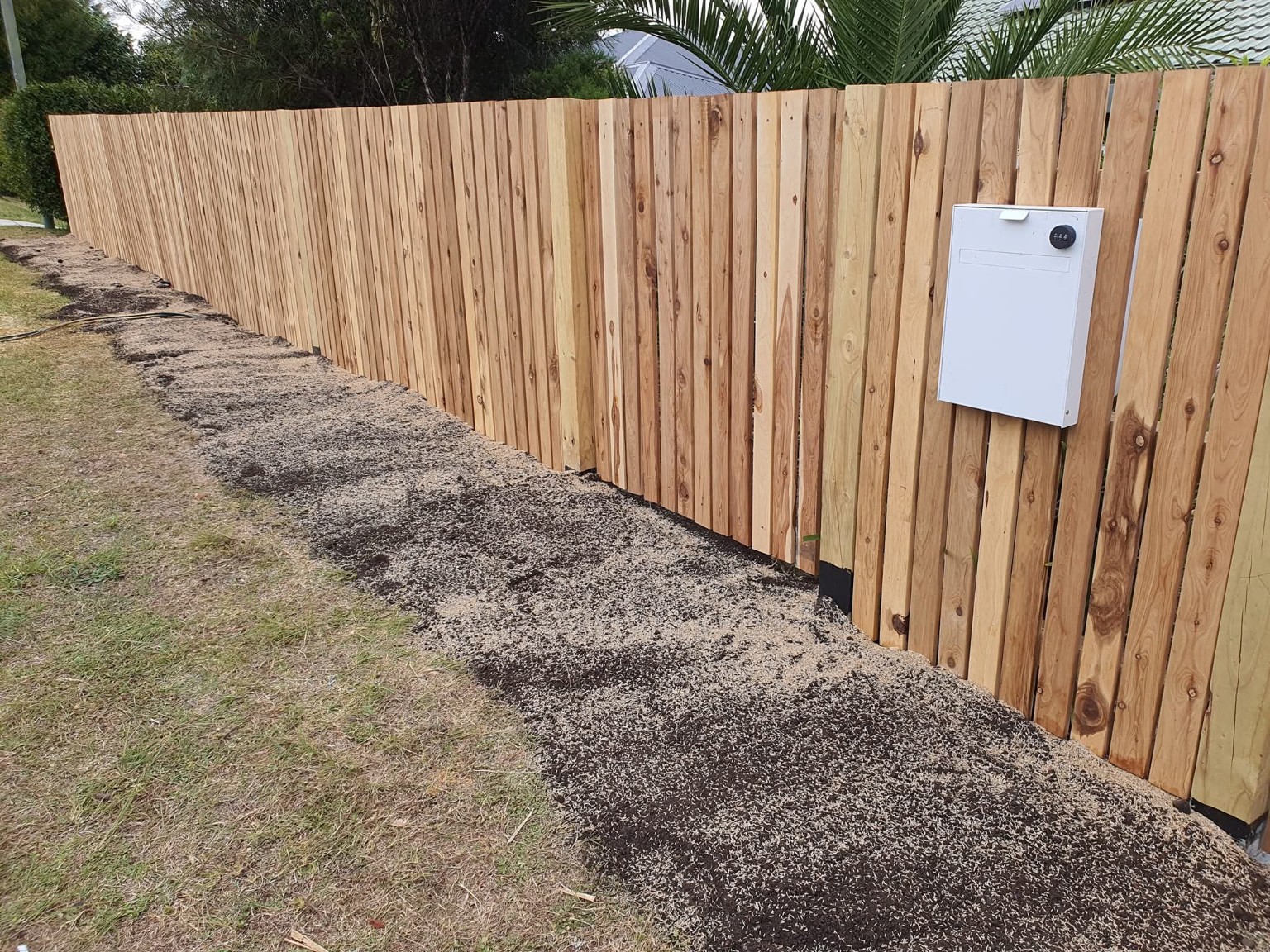 Timber picket fence